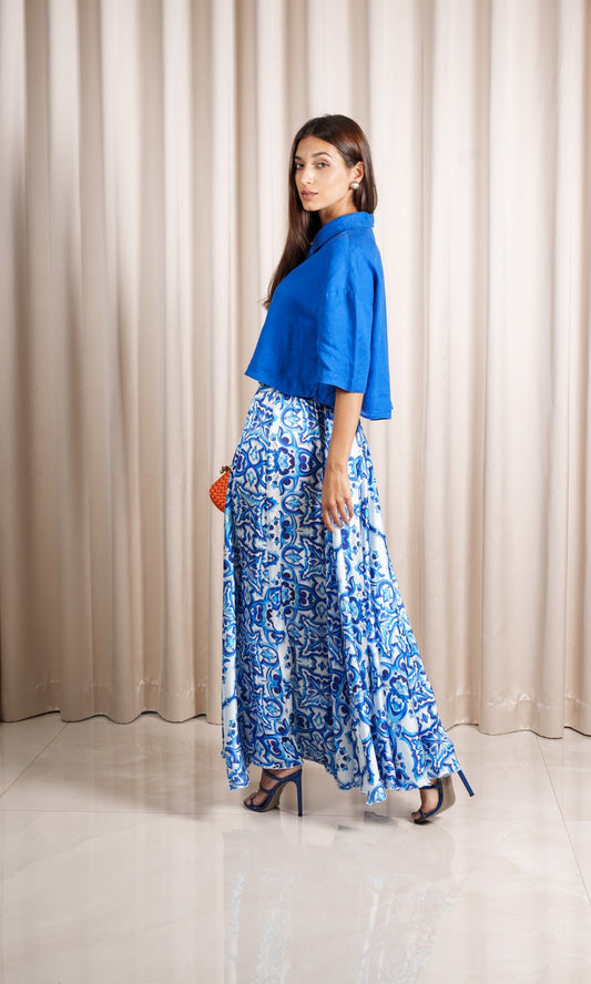 Model wears crepe silk blend adorned with a captivating print in blue hue